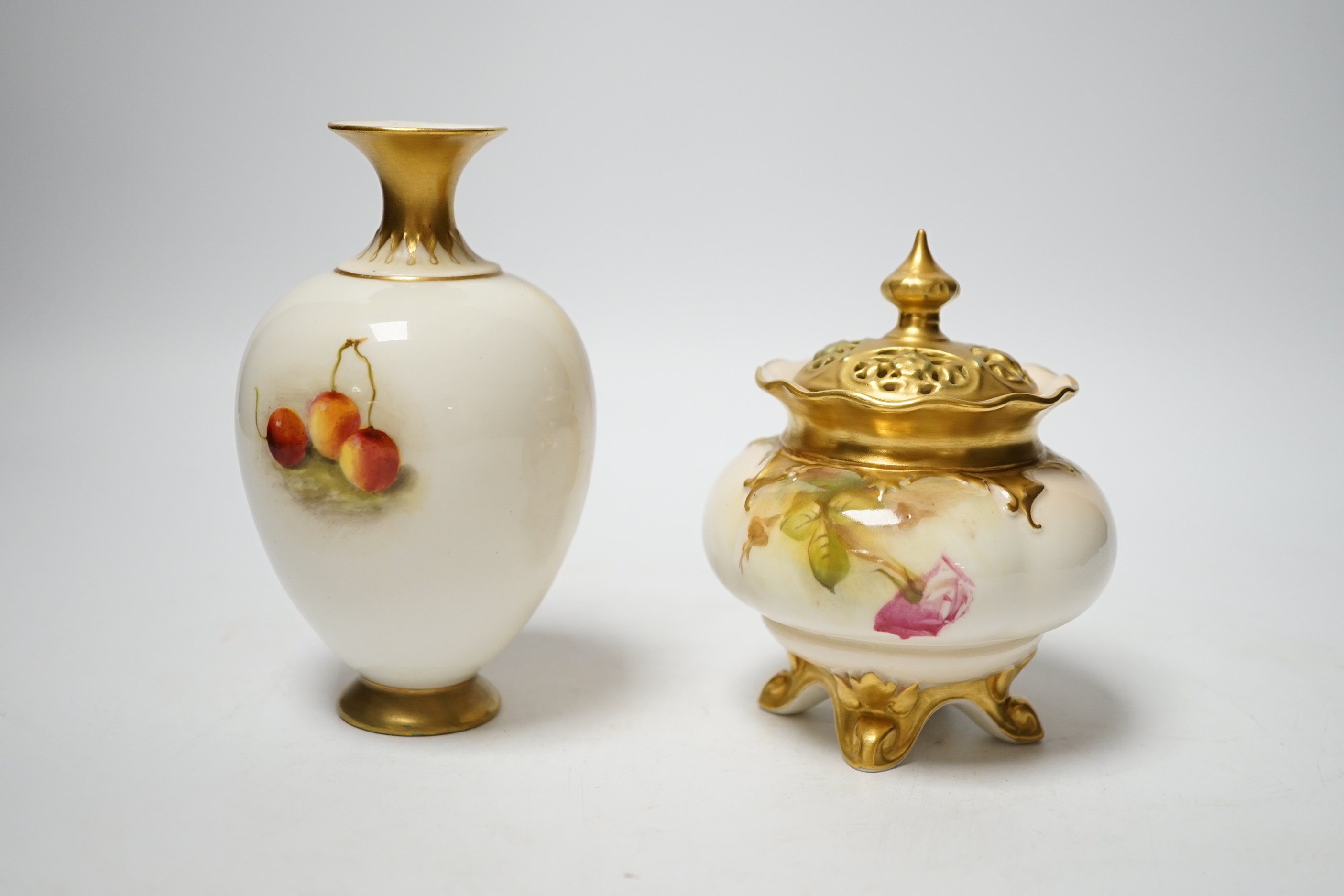 A Worcester fruit painted vase, signed Ricketts and a Royal Worcester rose painted pot pourri signed E. Spilsbury, tallest 13cm